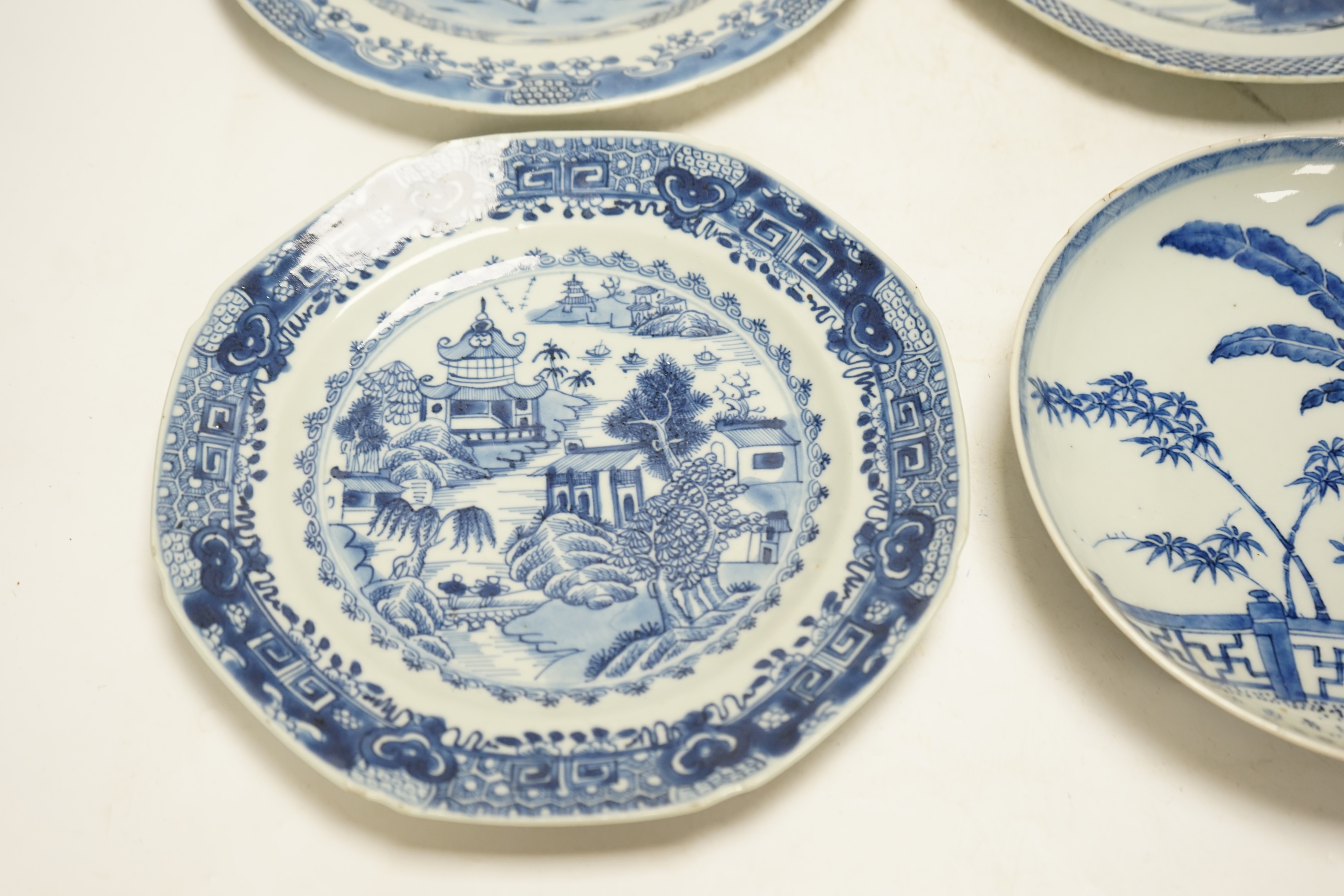 Four various Chinese export blue and white dishes, 18th/19th century, largest 26cm, largest 26cm diameter. Condition - one plate cracked, chips to another